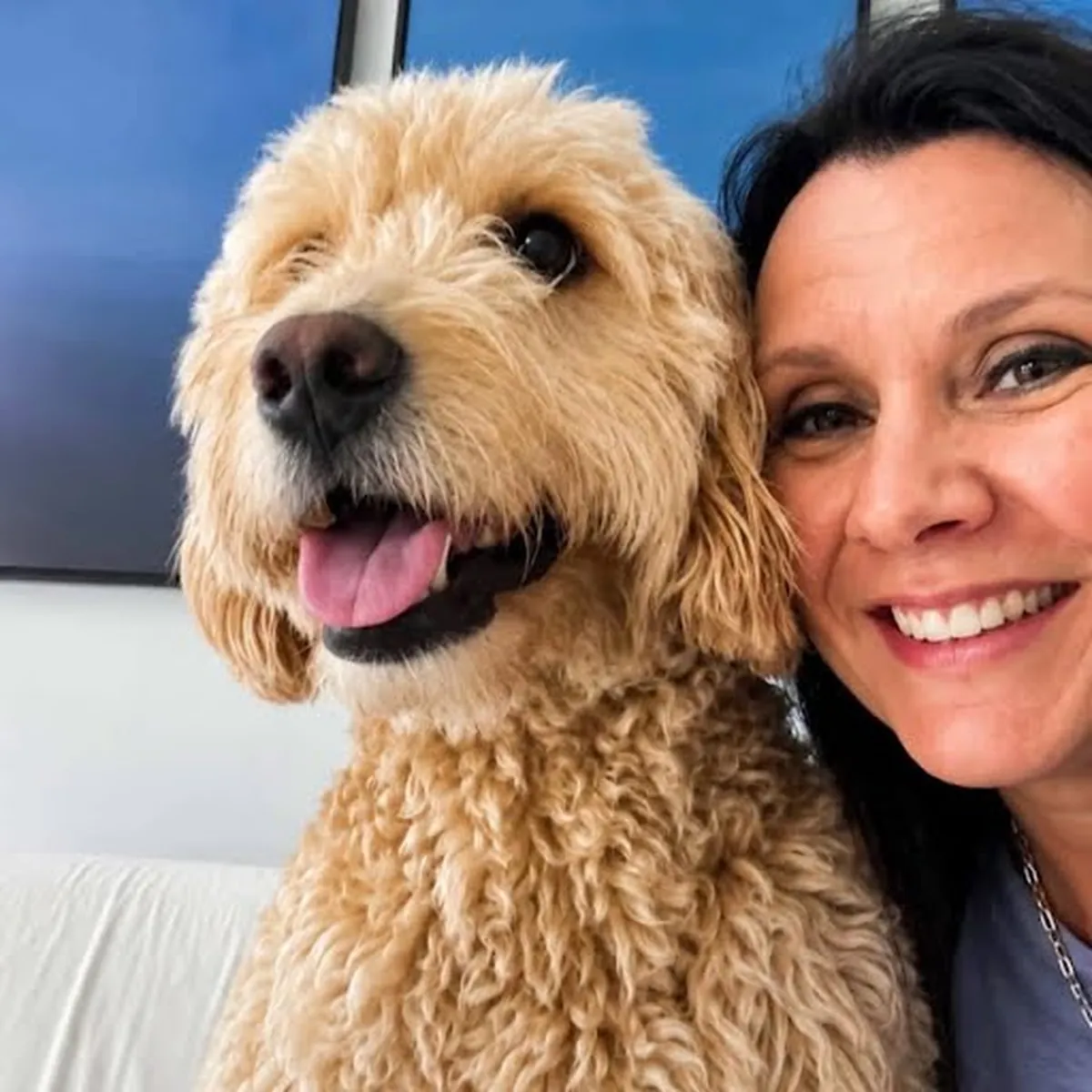 Rebecca Gage with a dog she transported — Pet Care and Transportation by Rebecca Gage flight nanny services.