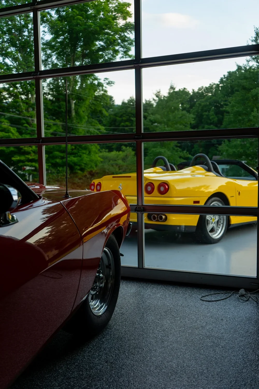 Collector cars inside the AUTOGALERIE shop.